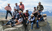 Guests and friends at Sierra West take a break from riding to pose on this rock outcrop for a unique photo.