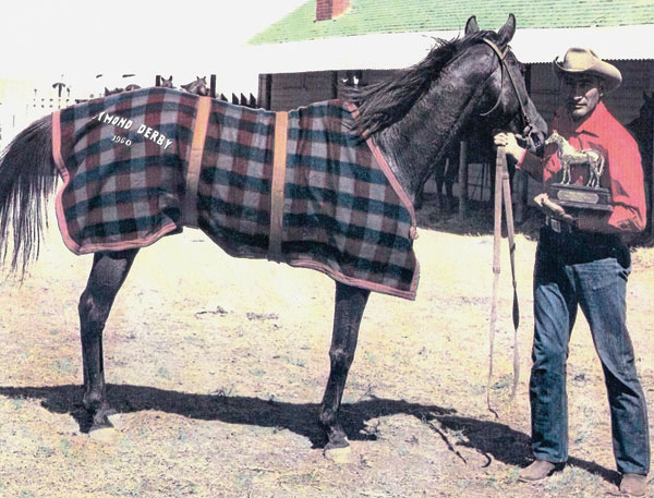 Rufus Goodstriker with one of his race horses, Whistling Fred, after winning the Raymond Businessmen’s Derby in 1960