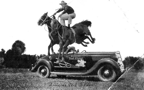 Roman-riding while jumping one of his signature Ford vehicles. Photo courtesy Raymond Museum.