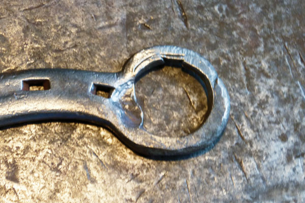 Create a lip to catch the edge of the bottle cap with a punch. Start back from the ring edge and set the metal down by half. Angle the punch towards the middle of the ring and move the metal ridge towards the center. As with the hoof pick, you can leave the heel as is, or add a horse head for added decoration.