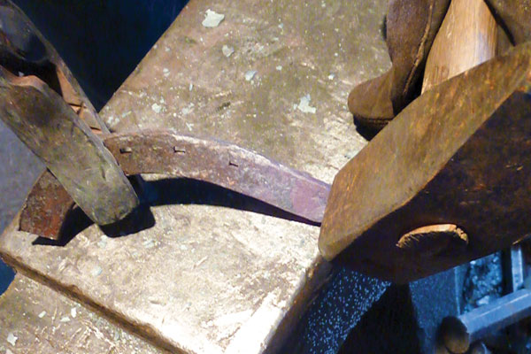 Chamfer the jaw line by holding it at an angle over the far side of the anvil with the chin hanging over the edge.